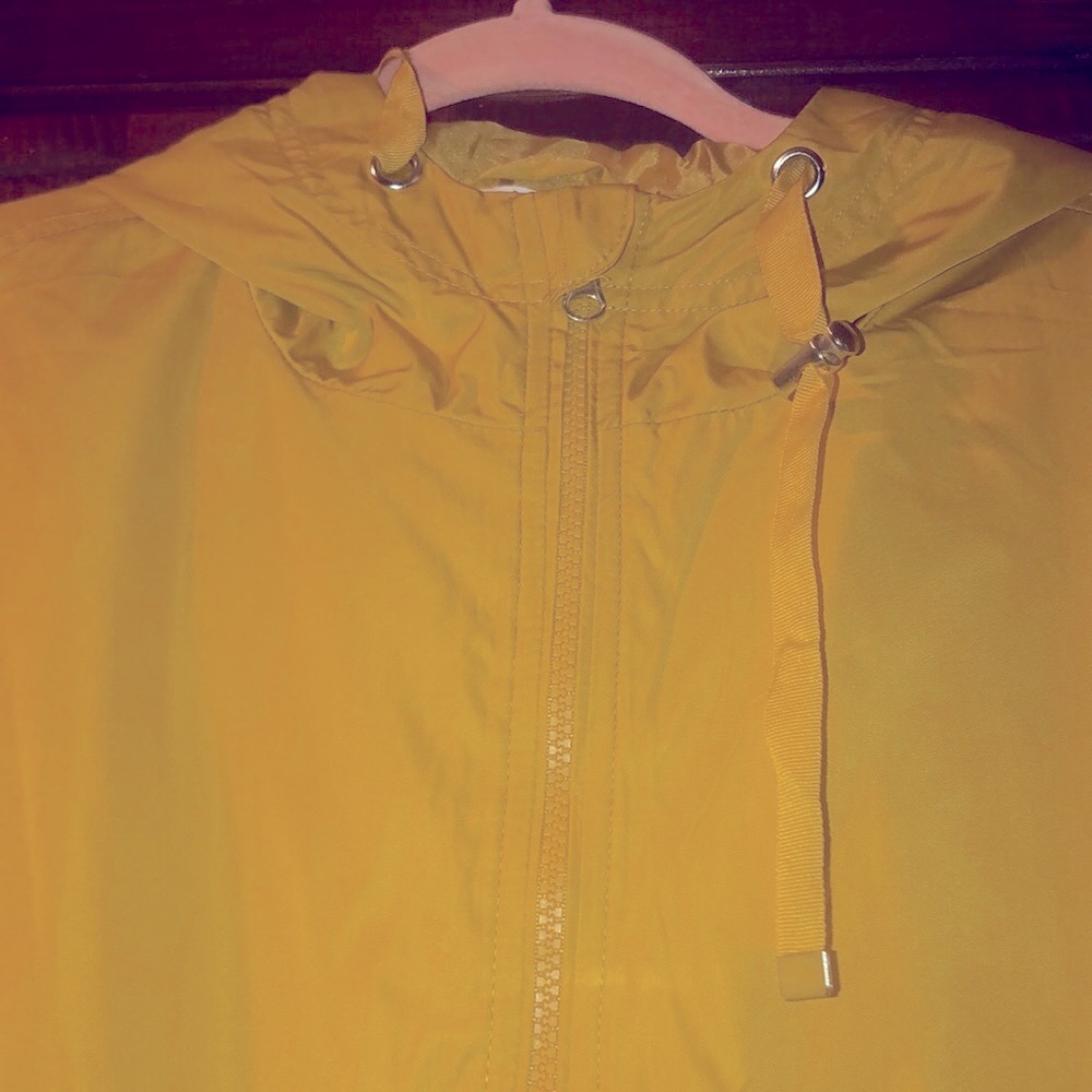 Size Large-Time and Tru light weight rain jacket. It is a gold like yellow.